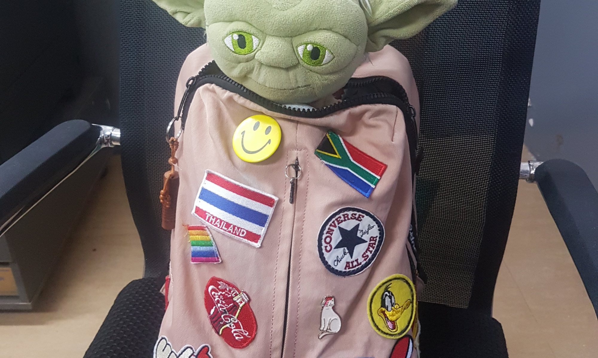 School bag with yoda doll inside